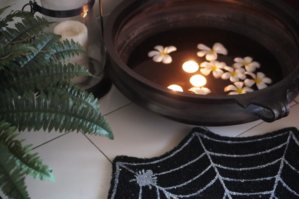 Halloween-Urli-Flower-bowl-with-flowers-and-candles