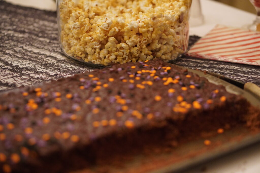 Texas-Sheet-Cake-with-Halloween-Sprinkles-and-Butter-Toffee-popcorn-in-a-glass-jar