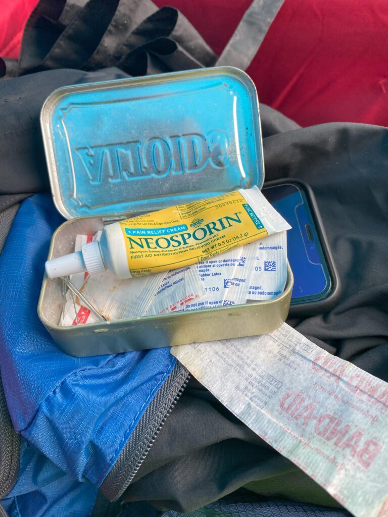 Altoids tin filled with Band-Aids and Neosporin